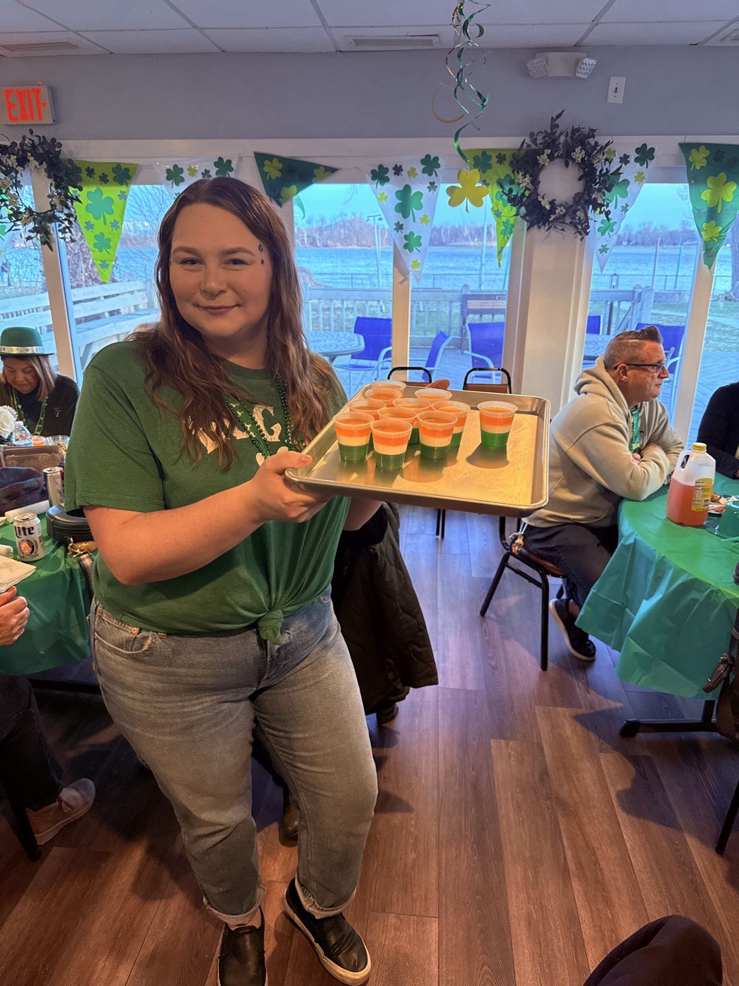 Members enjoying a St. Patrick's Day event in the Pennsylvania Yacht Club hall
